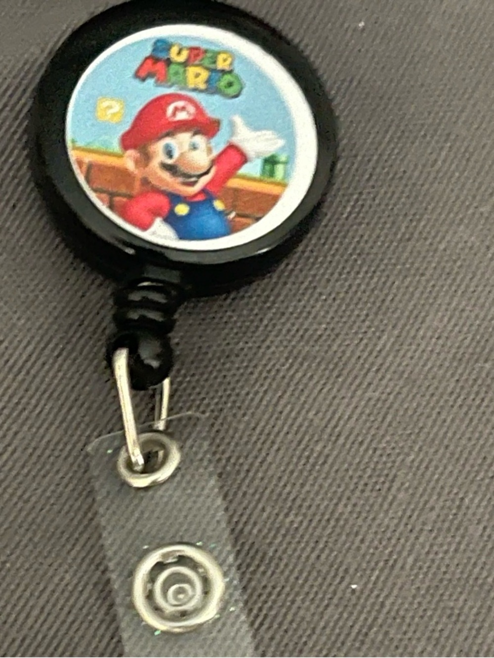 Super Mario Black Badge Reel with Mario Graphic